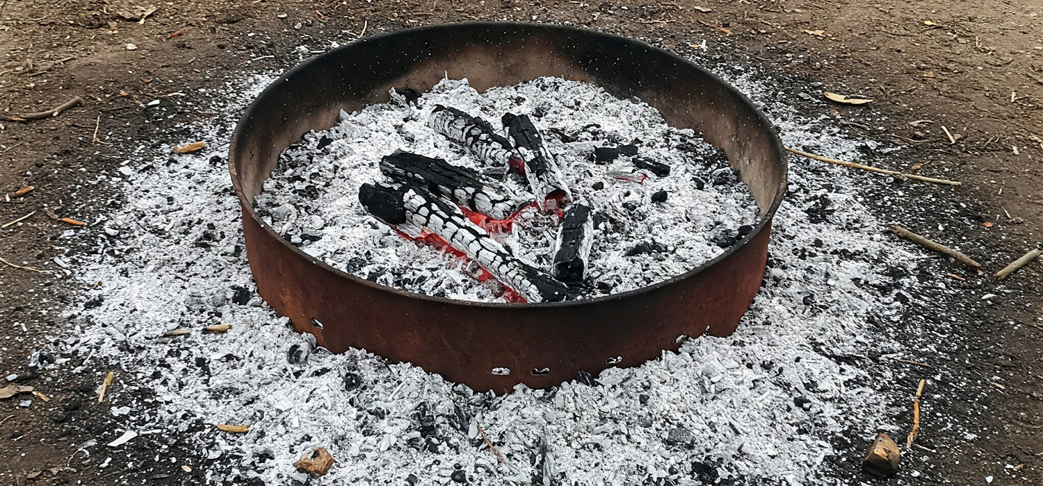 Fire pit ashes on ground