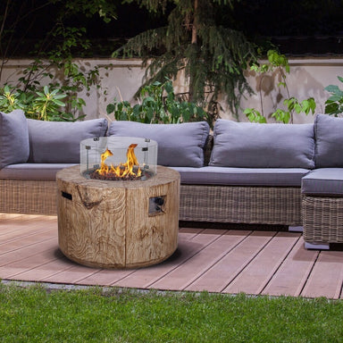 Verano Round Gas Firepit Table By Charlton And Jenrick Set on Garden Decking