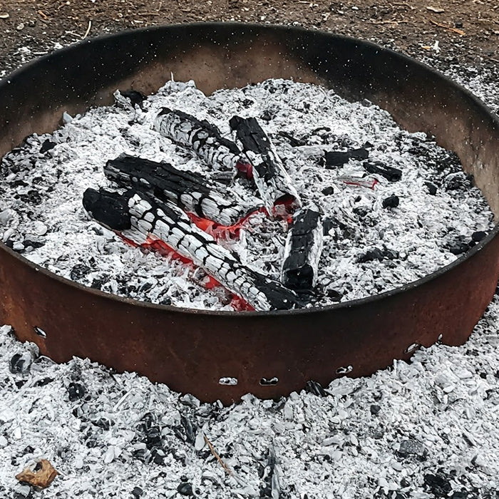Fire pit ashes on ground