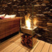 EcoSmart Fire Ghost Set Outdoors on dekcking with Log pile