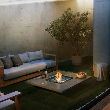 EcoSmart Fire Vertigo 50 Bioethanol Firepit table lit in seating area ready for use.